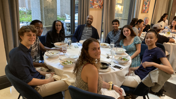Theater Studies Professor Doug Jones and TI summer graduate fellow Ejuerleigh Jones enjoy a meal with students at the TI welcome dinner.