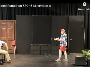 man and woman perform on stage