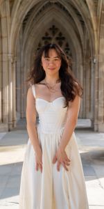 Young Asian woman posing in a Gothic alcove