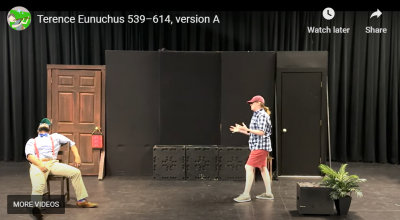 man and woman perform on stage